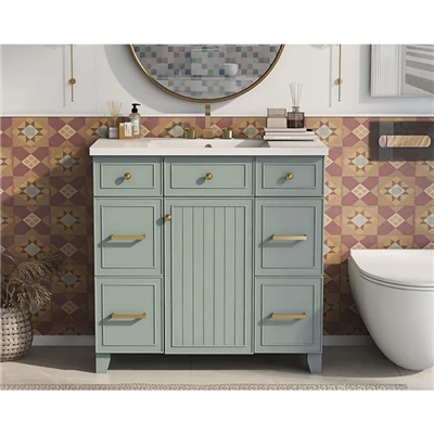 Meuble de salle de bain peint en vert clair avec vasque en résine